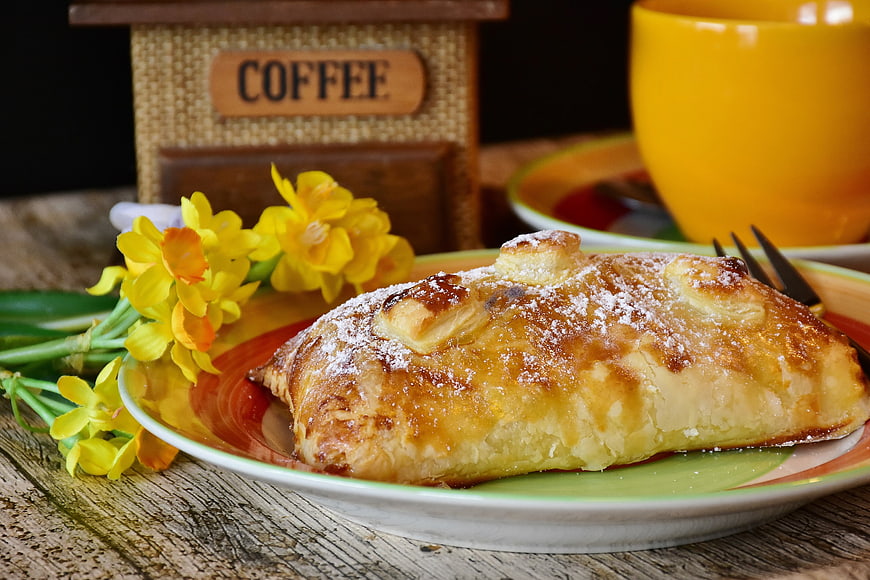 Golden Apple Turnover Pastry with Coffee and Daffodils