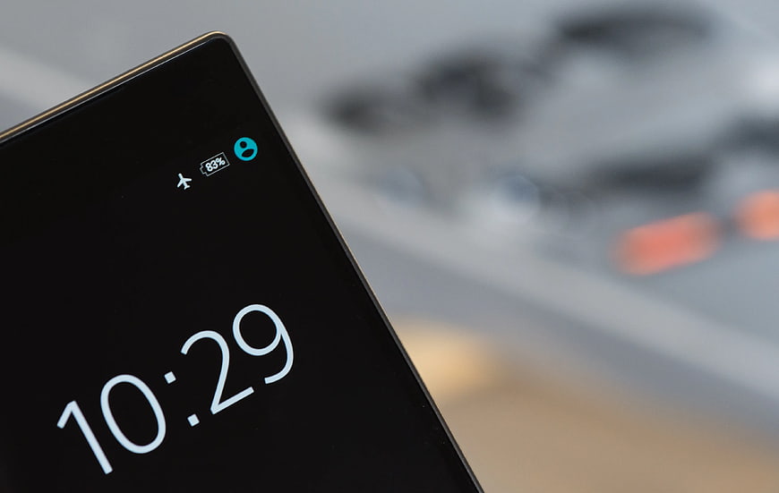 Close-up of Smartphone Screen Showing Time and Battery