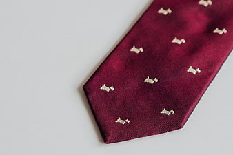 Maroon Silk Tie with White Dog Pattern on White Background