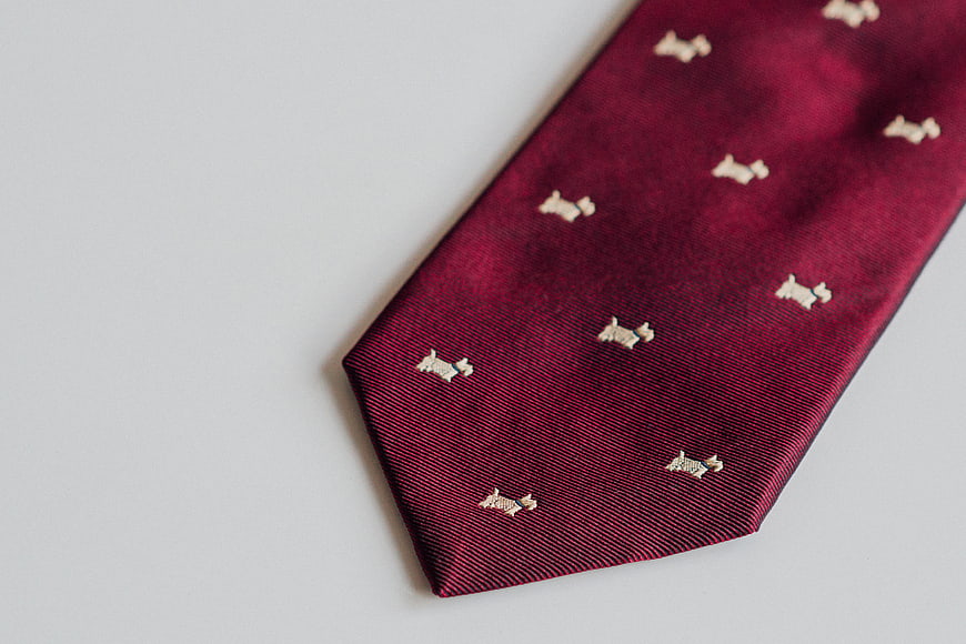Maroon Silk Tie with White Dog Pattern on White Background