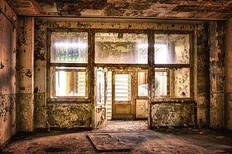 Abandoned Interior Room with Peeling Paint and Decaying Walls