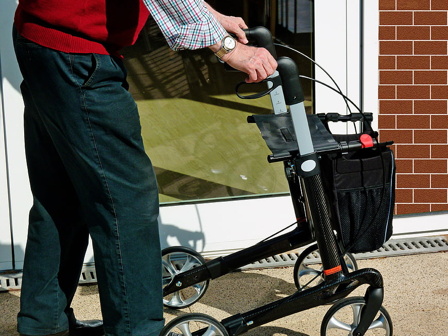 Senior Man Using Carbon Fiber Rollator Walker Outside
