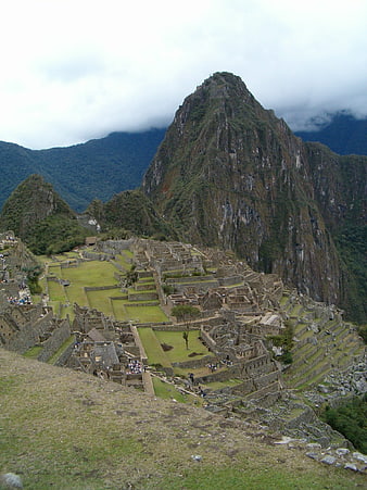 Machu Picchu ruins with Huayna Picchu mountain background