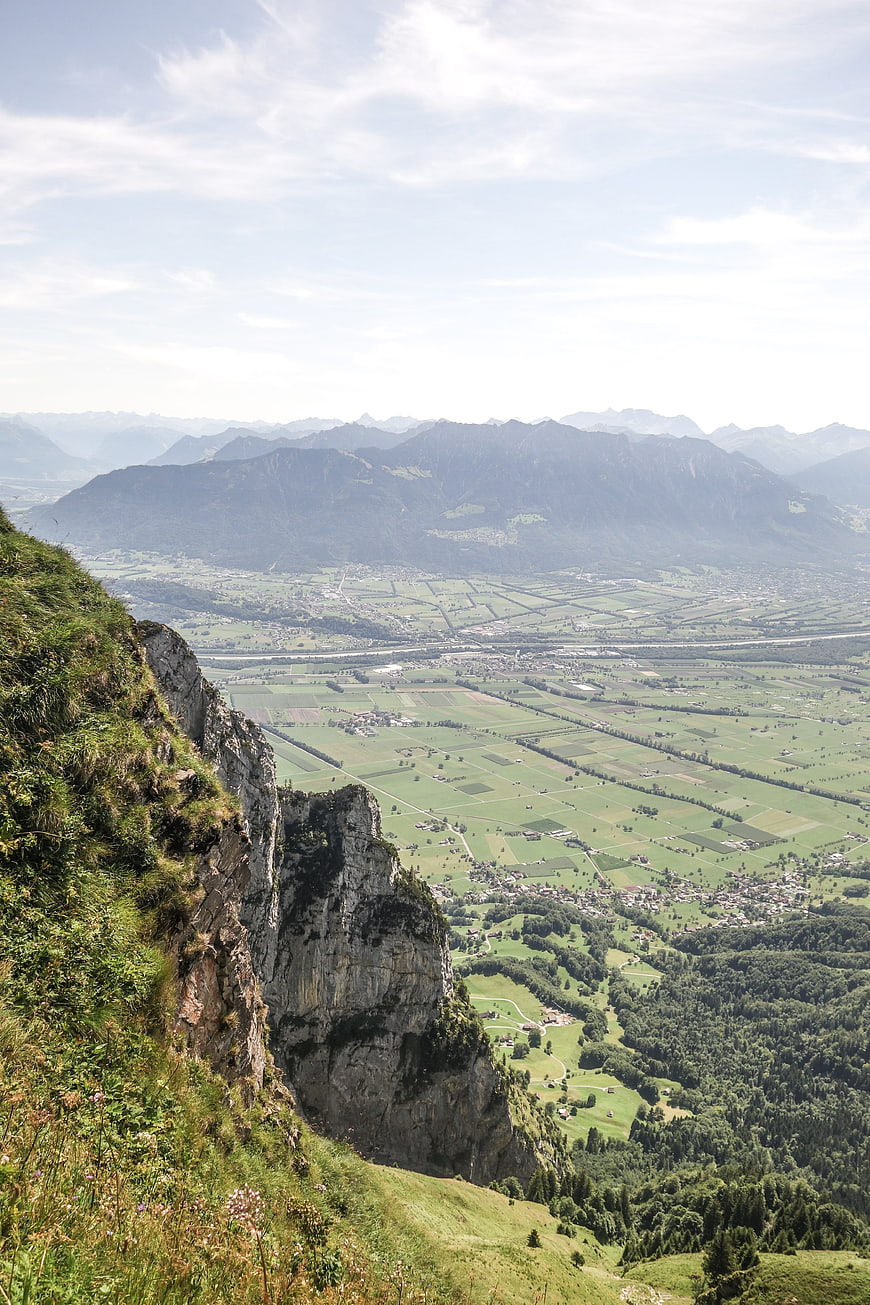 Panoramic Alpine Valley View from Rocky Cliff Edge