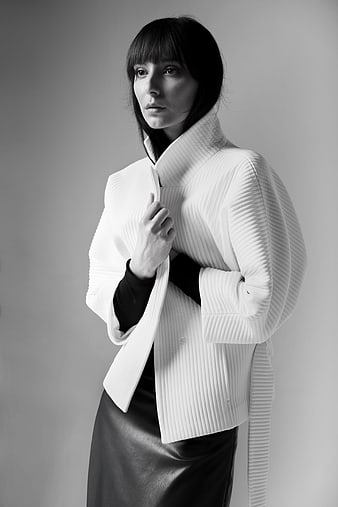 Fashion Portrait of Woman in Pleated White Jacket