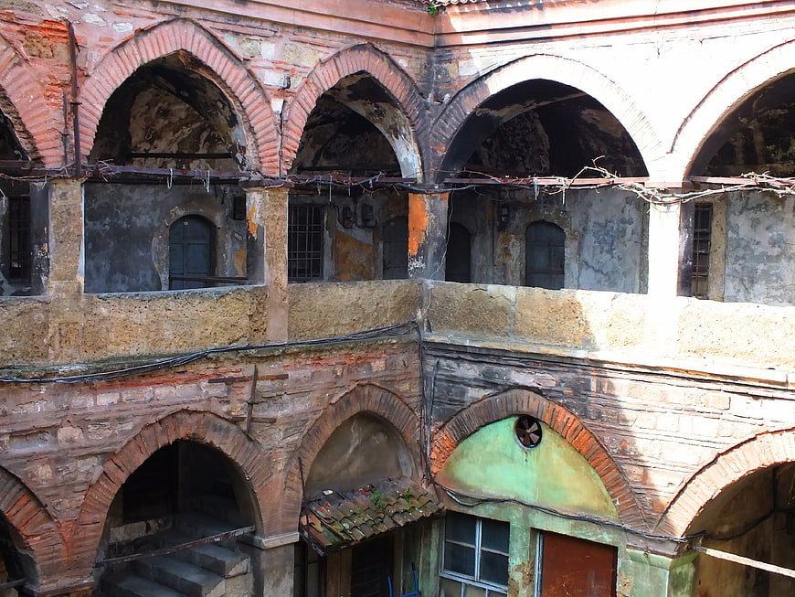 Old brick arches of a dilapidated historical building courtyard