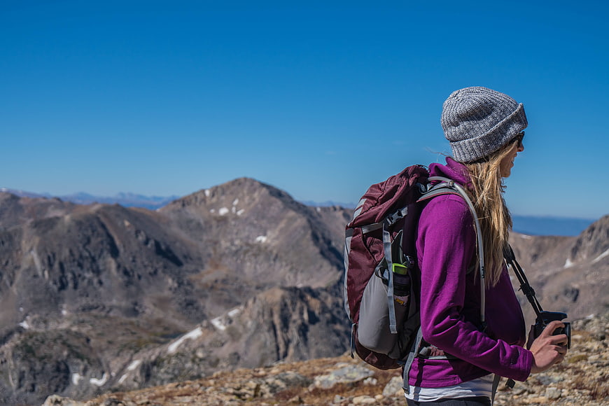 Female Hiker with Backpack on Mountain Ridge
