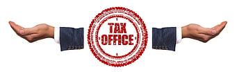 Business hands presenting red tax office rubber stamp