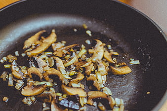 Sautéed Mushrooms and Onions in a Frying Pan