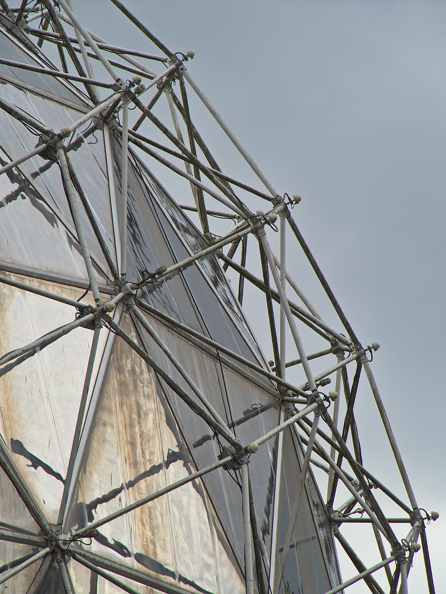 Close-up of metal scaffolding structure against gray sky