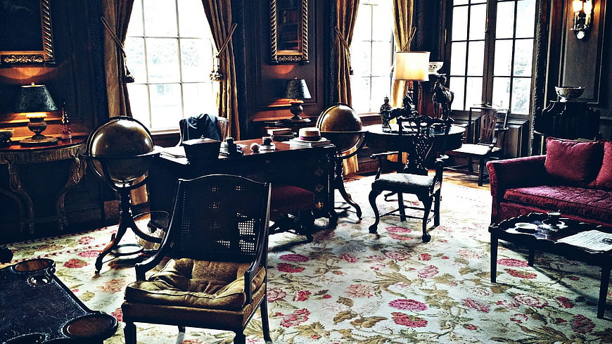 Historic Victorian Study Interior With Antique Furniture And Globe