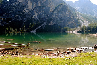 Serene Alpine Lake with Emerald Waters and Mountain Reflections