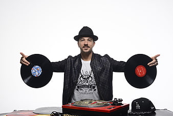 DJ Holding Vinyl Records With Turntable