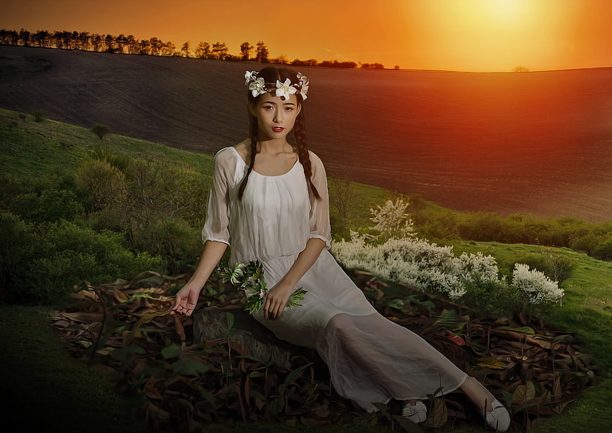 Young Asian Woman in White Dress Sitting in Fantasy Forest at Sunset