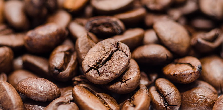 Close-up of roasted coffee beans with shallow depth of field