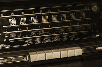 Close-up of vintage radio dial and buttons