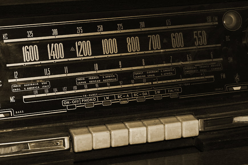 Close-up of vintage radio dial and buttons