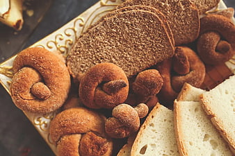 Assortment of fresh baked bread and pastries on a plate