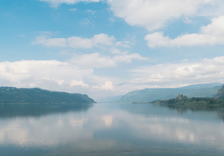Serene Lake Landscape with Cloud Reflections and Mountains