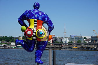 Colorful Mosaic Sculpture of Woman by Waterfront
