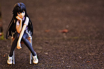 Anime Figure of Girl Sitting on Chair with Thoughtful Pose