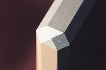 Abstract Geometric Corner with Textured Surfaces and Gradient Background