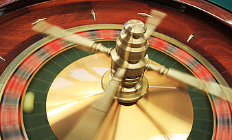 Spinning Roulette Wheel With Blurred Motion And Brass Center