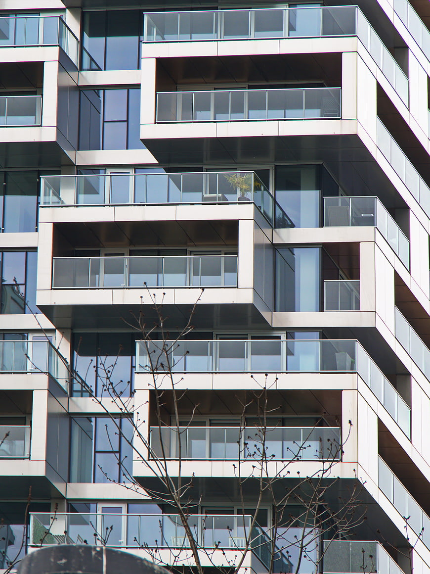 Modern Apartment Building Facade with Glass Balconies