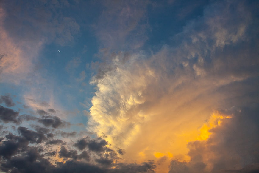 Dramatic Sunset Sky With Golden Clouds And Blue Horizon
