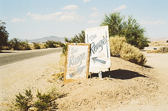 Hand-painted desert signs for The Range live music venue
