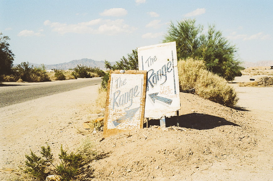 Hand-painted desert signs for The Range live music venue