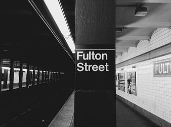 Black and white Fulton Street subway station sign
