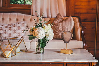 Elegant Living Room Decor with Flowers and Geometric Candle Holders