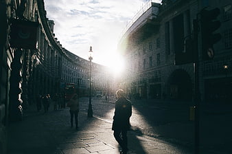 Man Walking on Regent Street London Backlit