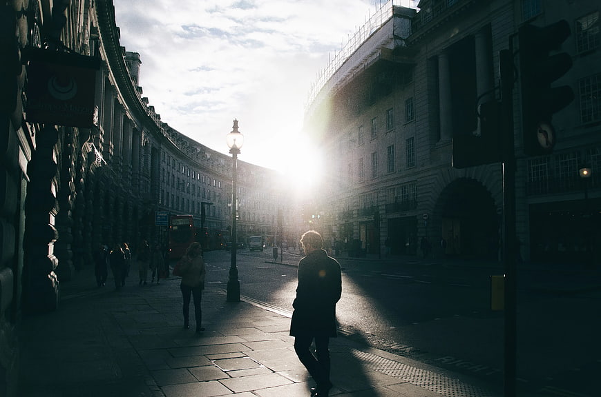 Man Walking on Regent Street London Backlit