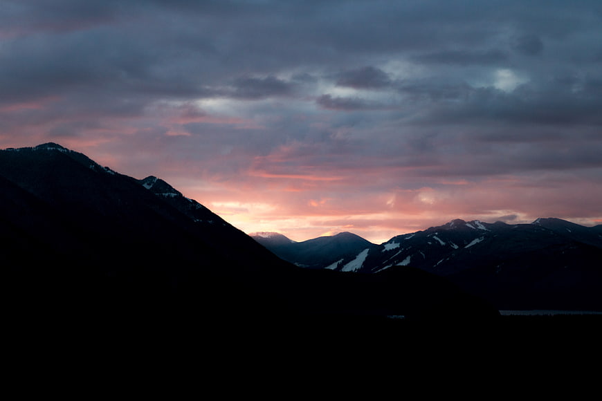 Dramatic Mountain Silhouette at Sunset with Pink Clouds