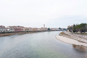 Wide river view of Verona Italy with historic architecture