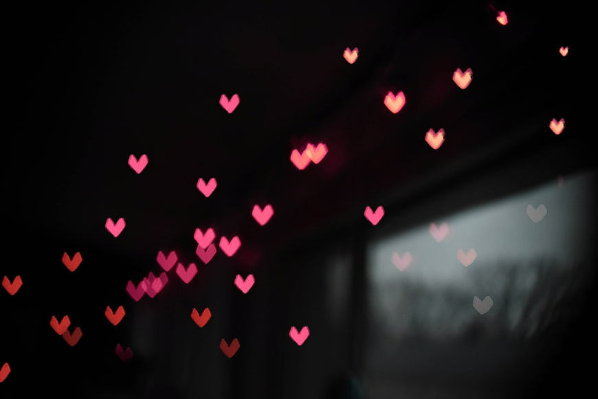 Pink Heart Bokeh Lights on Dark Background