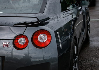 Close-up of Wet Black Nissan GT-R Rear Taillights