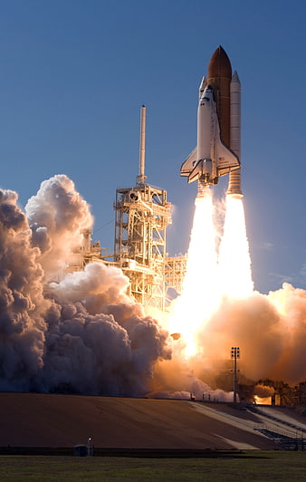 NASA Space Shuttle Discovery Launching into Blue Sky