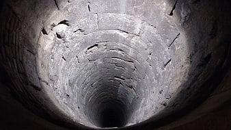 Looking Up Inside An Old Deep Brick Well Shaft