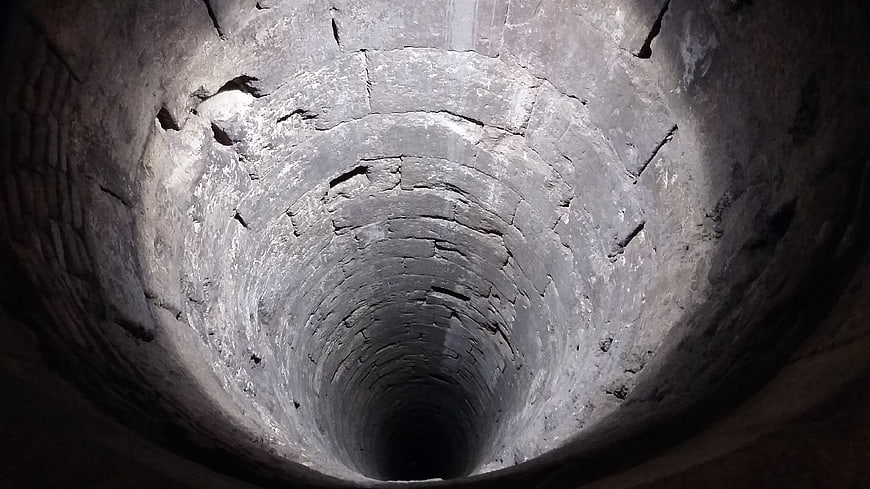 Looking Up Inside An Old Deep Brick Well Shaft