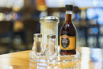 Restaurant condiment caddy with vinegar, salt, and pepper
