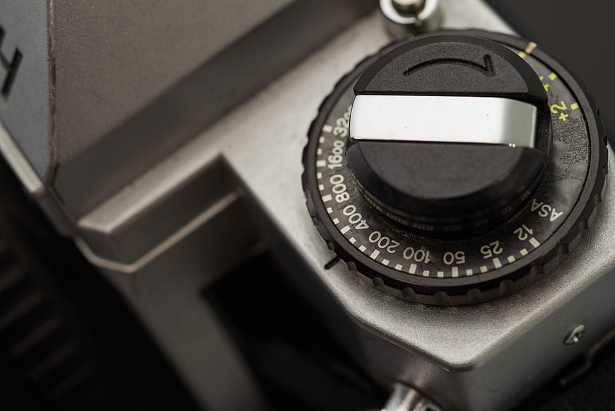 Close-up of vintage camera ISO dial and metal body