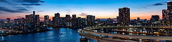 Panoramic Tokyo Bay Skyline at Dusk with Rainbow Bridge