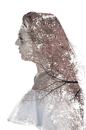 Artistic double exposure woman silhouette with autumn leaves