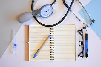 Medical Flat Lay With Stethoscope, Notebook, Pen, And Glasses