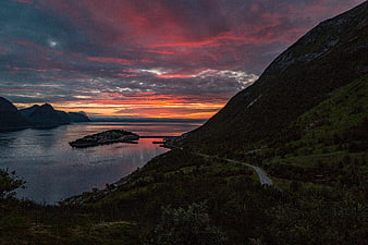 Dramatic Sunset Over Norwegian Fjord with Coastal Village