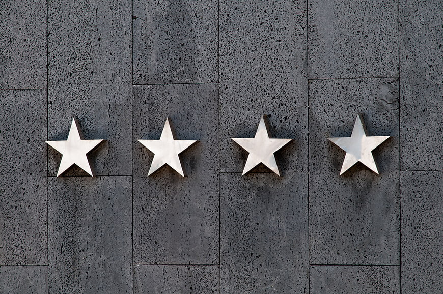 Four Silver Stars on Gray Stone Wall