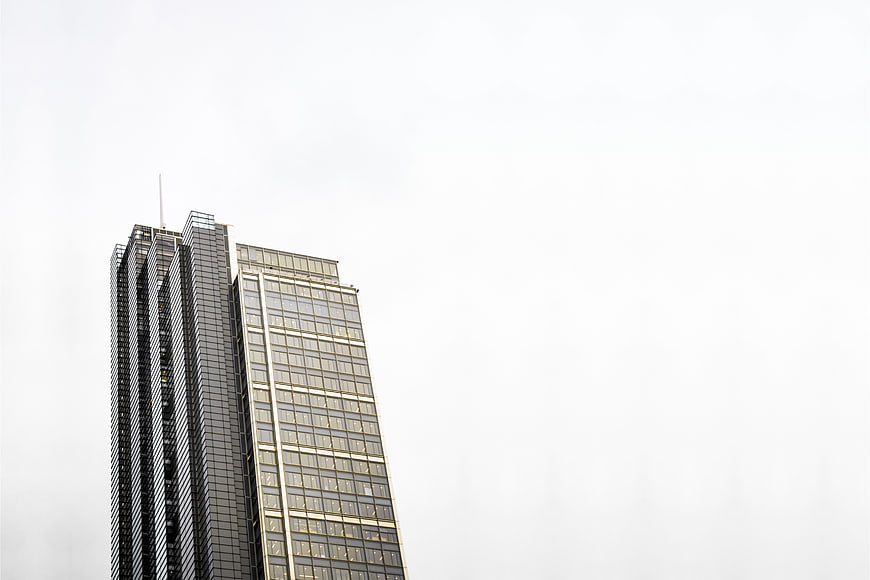 Modern Skyscraper Against White Sky